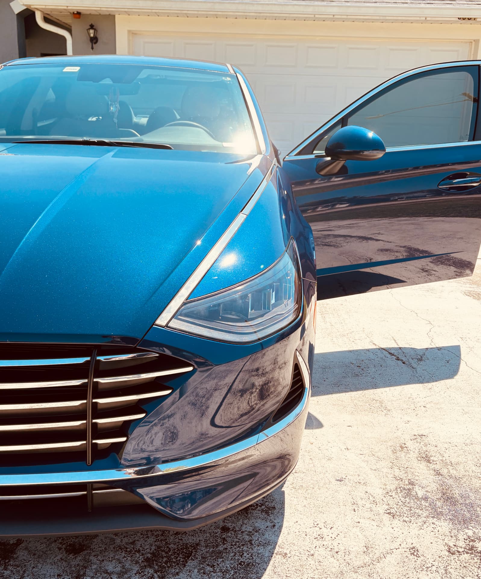 Blue Hyundai Sonata with a deep gloss finish after an exterior wash and polish